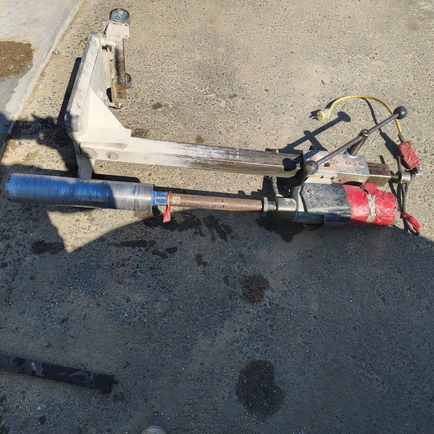Heavy-duty curb coring machine for precise concrete cutting and removal.